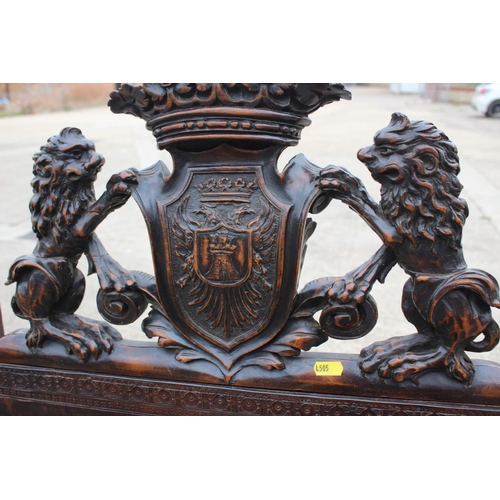 374 - A Renaissance Revival carved walnut armchair with lion and coat of arms top rail, and leather seat a... 