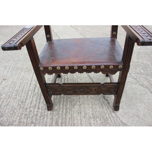 374 - A Renaissance Revival carved walnut armchair with lion and coat of arms top rail, and leather seat a... 