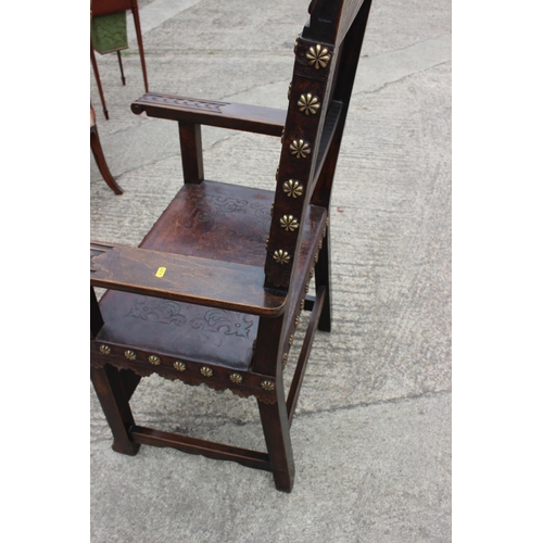 374 - A Renaissance Revival carved walnut armchair with lion and coat of arms top rail, and leather seat a... 