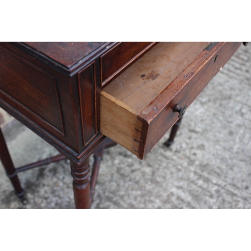 387 - A 19th century mahogany sewing table, fitted two drawers, on slender turned and castored supports, 3... 