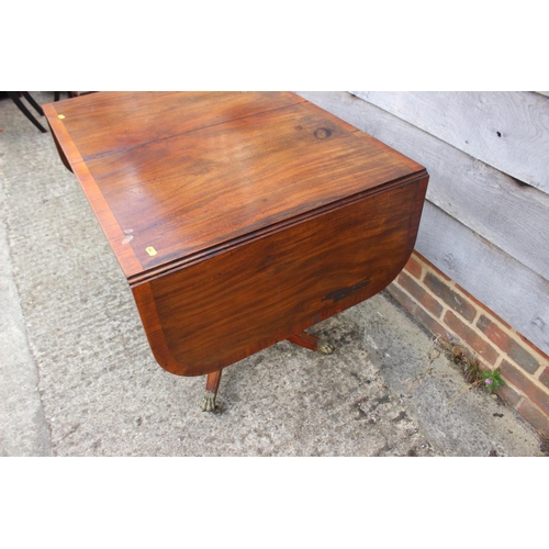 388 - An early 19th century mahogany and satinwood banded sofa table, fitted two frieze drawers, on square... 