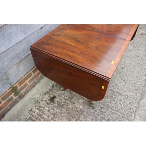 388 - An early 19th century mahogany and satinwood banded sofa table, fitted two frieze drawers, on square... 