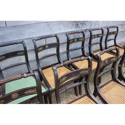 393 - A set of twelve Regency ebonised and brass rope mounted rope twist bar back dining chairs with cane ... 