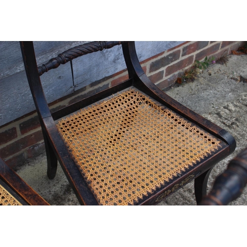 393 - A set of twelve Regency ebonised and brass rope mounted rope twist bar back dining chairs with cane ... 