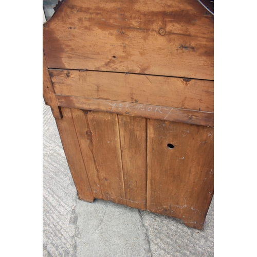 406 - A late 19th century mahogany ledge back chiffonier with frieze drawer over cupboards, on block base,... 