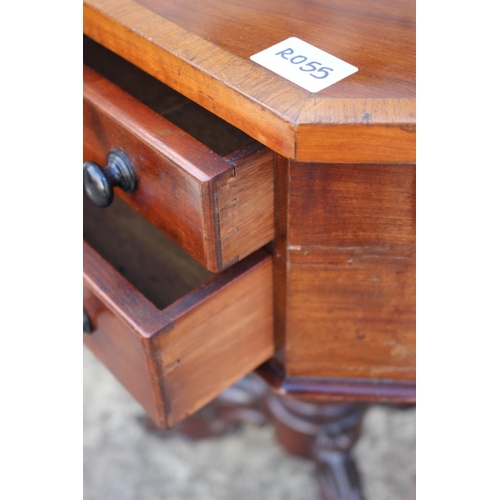 424 - A 19th century mahogany and satinwood banded octagonal top work table, fitted two drawers, on carved... 