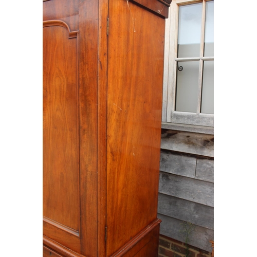 428 - A 19th century mahogany linen press, the upper section enclosed two doors, over two short and two lo... 