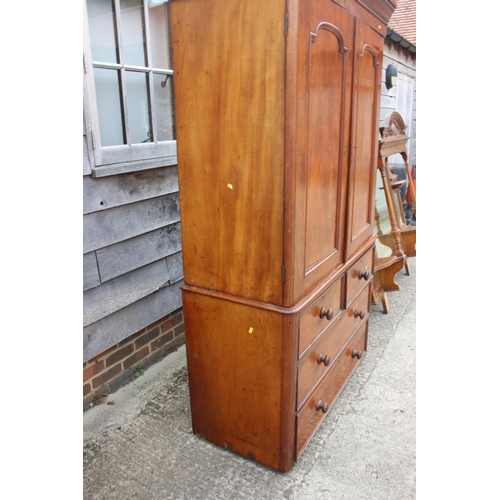 428 - A 19th century mahogany linen press, the upper section enclosed two doors, over two short and two lo... 