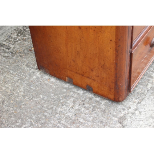 428 - A 19th century mahogany linen press, the upper section enclosed two doors, over two short and two lo... 