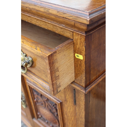 429 - A late 19th century carved oak dresser with raised back mirrors and shelves, over three drawers, cen... 