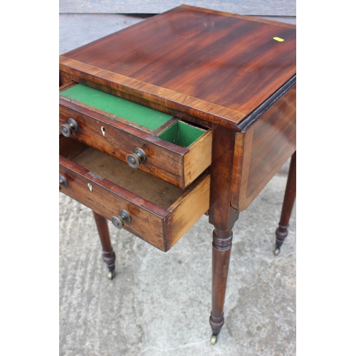 430 - A 19th century mahogany and banded flap top writing table, fitted two drawers, on turned and castore... 