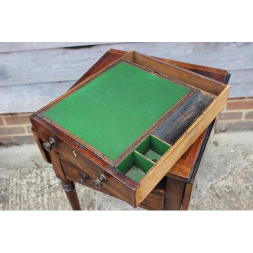 430 - A 19th century mahogany and banded flap top writing table, fitted two drawers, on turned and castore... 