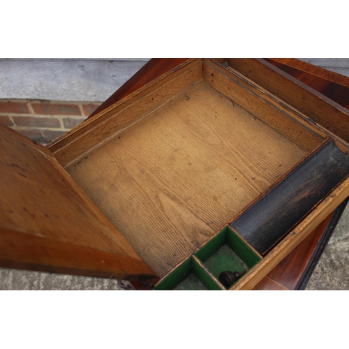 430 - A 19th century mahogany and banded flap top writing table, fitted two drawers, on turned and castore... 