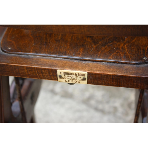 483 - A child's early 20th century oak metamorphic high chair, by T Briggs & Sons