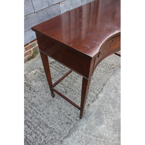 506 - A mahogany serpentine top table, fitted two drawers, on square taper supports, 41 1/2