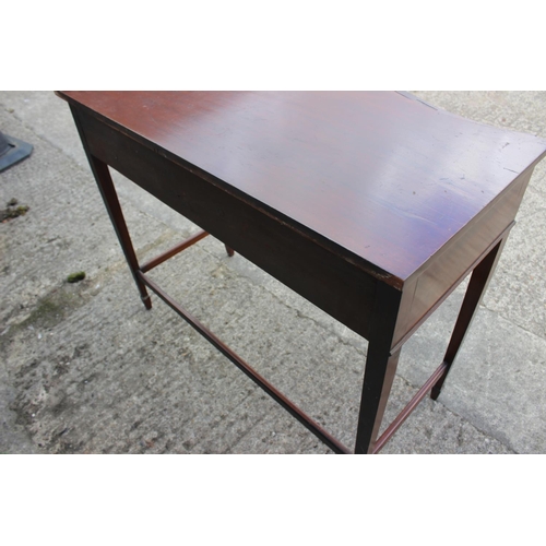 506 - A mahogany serpentine top table, fitted two drawers, on square taper supports, 41 1/2