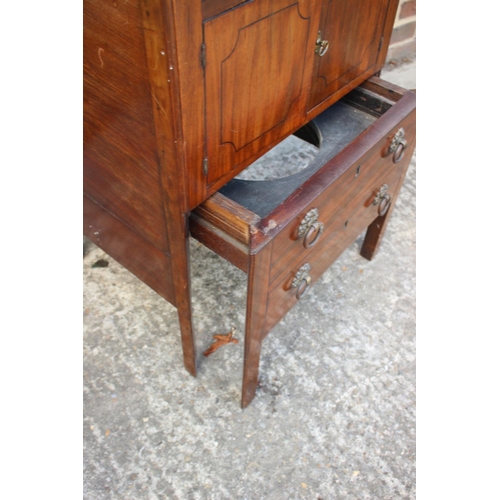 509 - A mahogany tray top bedside cupboard/commode over pull-out slide, 20