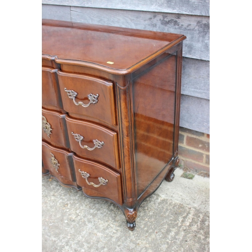 540 - A pair of early 18th century design walnut serpentine front chests of three long drawers, on cabriol... 