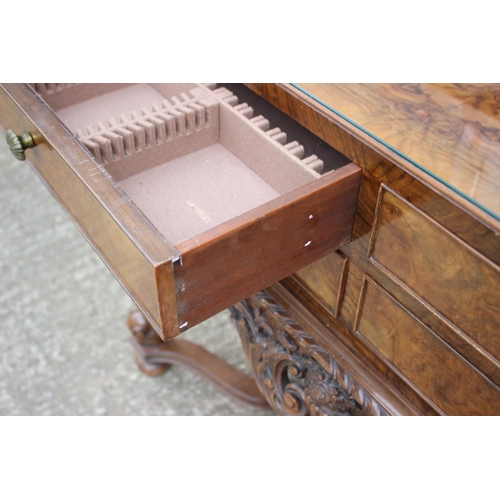 541 - A 1930s burr walnut table canteen, fitted four short drawers, on cabriole supports united by an unde... 