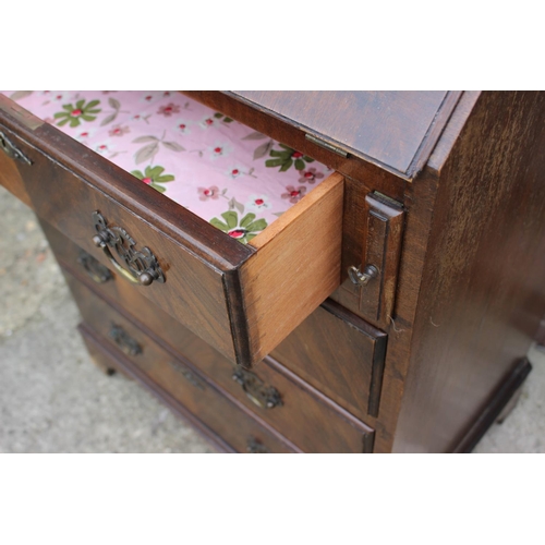 559 - A polished as mahogany arch top bureau bookcase with fall front and fitted interior, over four long ... 