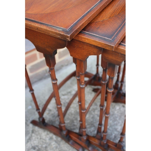 564 - A nest of four mahogany and banded quartetto tables, largest 20