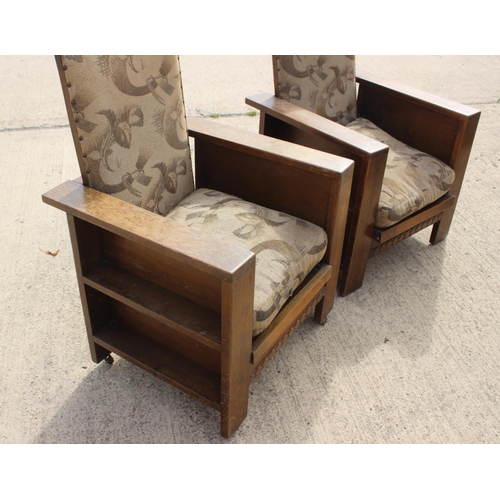 570 - A pair of 1930s E Rolfe oak adjustable reading chairs, upholstered in a floral fabric, stamped N# 28... 