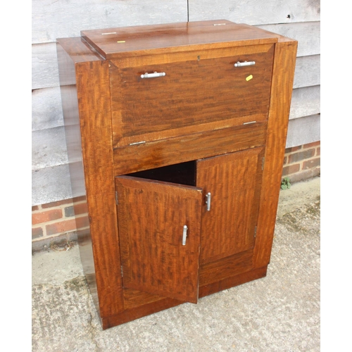 579 - A 1930s mahogany display cabinet enclosed single glazed door, on cabriole supports, 41