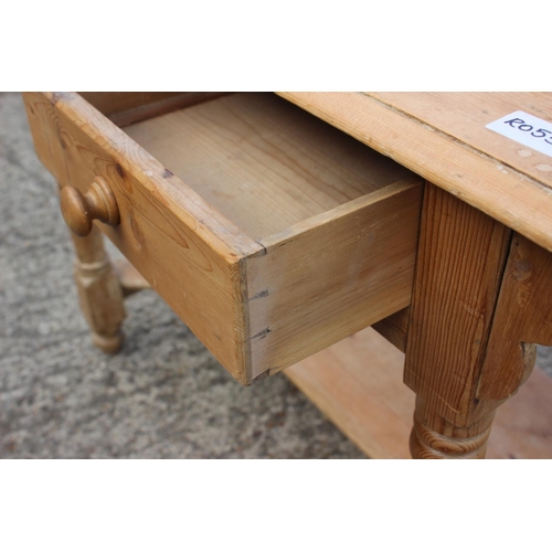 588 - A Victorian stripped pine ledge back washstand, fitted two drawers, on turned supports united by an ... 