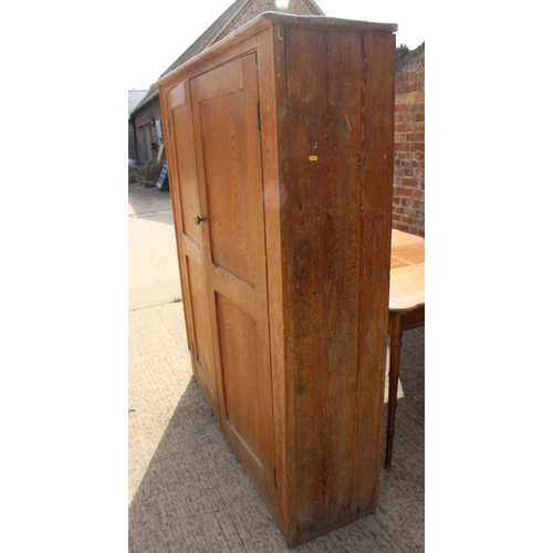 591 - A pine larder cupboard enclosed two doors, 56