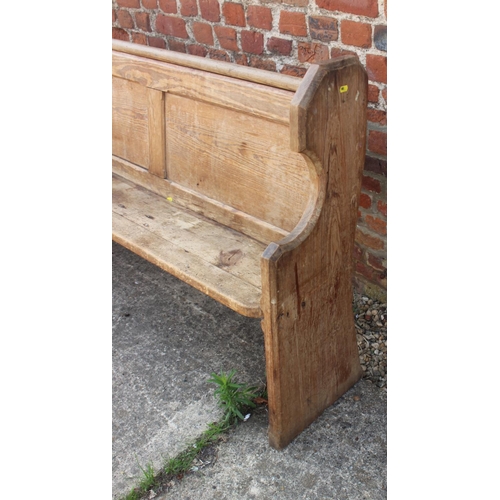 595 - A pine pew with panel ends, 60