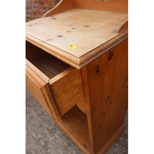 596 - A pine bedside cabinet, fitted one drawer over recess, 16