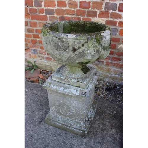 620 - An antique cast stone planter with swag decoration, on square base, 29