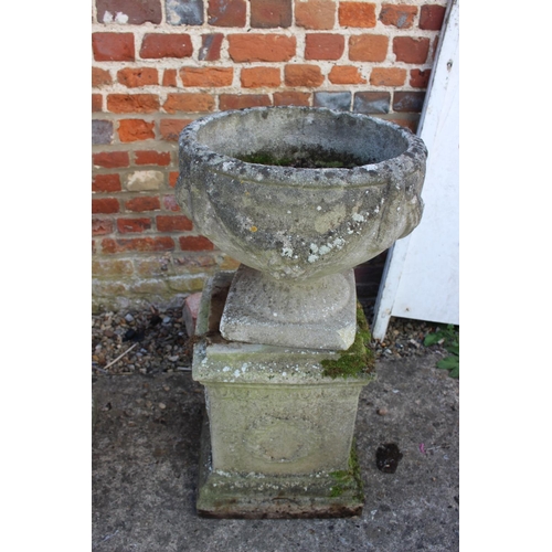 621 - An antique cast stone planter with swag decoration, on square base, 29