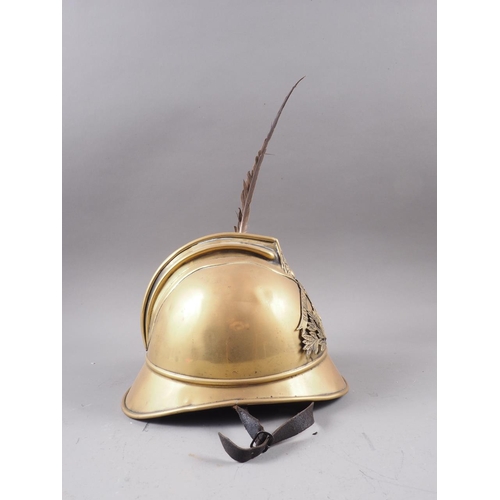 114 - A fireman's trench brass helmet, 