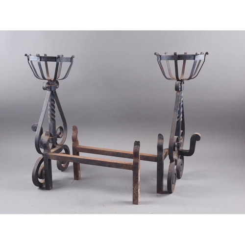 125 - A pair of wrought iron cresset dogs, 19 1/2