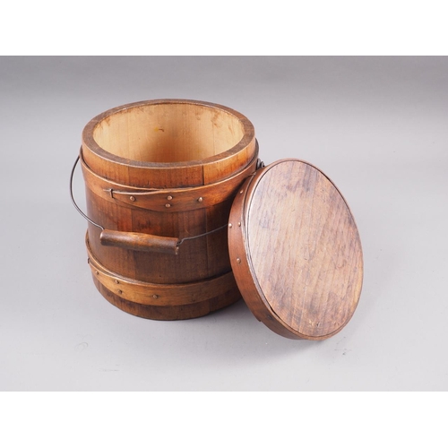 134 - A 19th century pine box and cover with swing handle, 