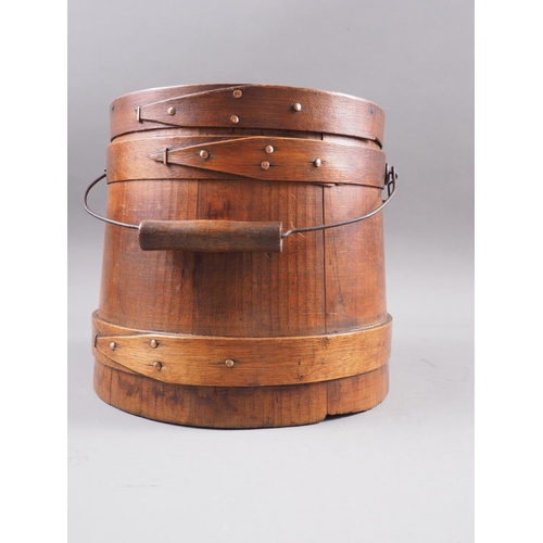 134 - A 19th century pine box and cover with swing handle, 