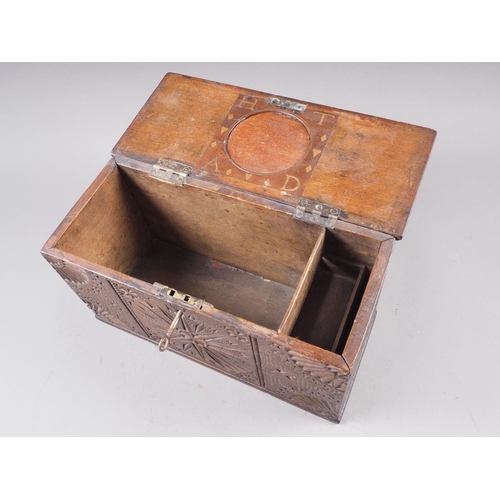 143 - An 18th century carved oak marriage box, inscribed 