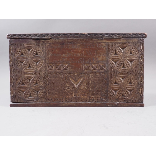 143 - An 18th century carved oak marriage box, inscribed 