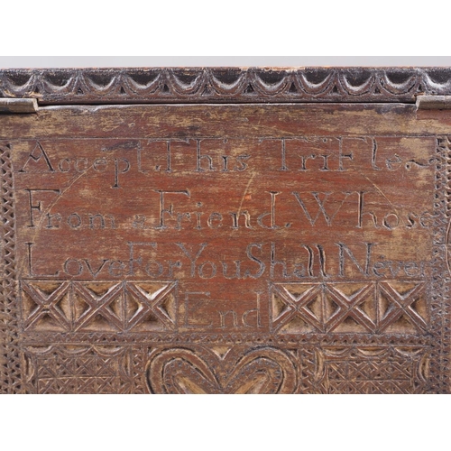 143 - An 18th century carved oak marriage box, inscribed 