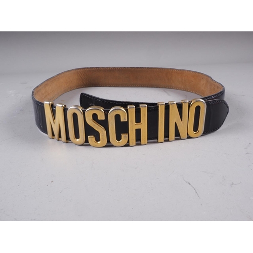 167 - A 1990s Moschino Redwall black leather and gilt metal letter waist belt, 35