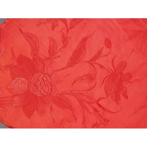 170 - An early 20th century red silk shawl with embroidery and tassel decoration, 64