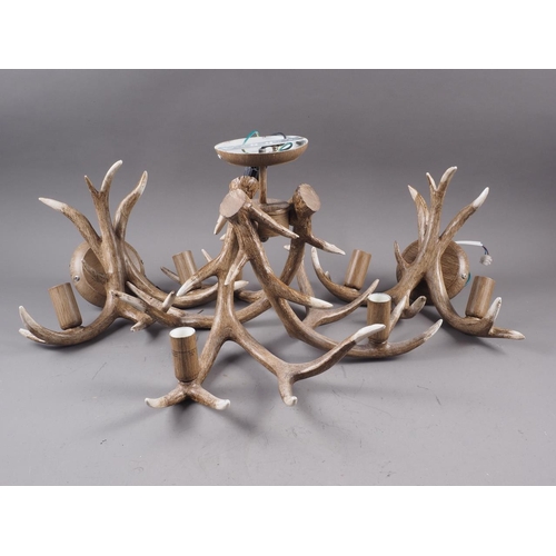 211 - A pair of resin antler two-branch wall lights and a matching ceiling light