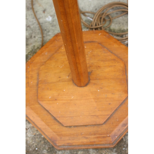 212 - A 1930s octagonal satinwood standard lamp, 60