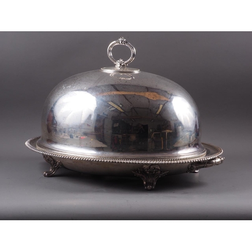 220 - A silver plated two-handled tree and well meat dish and associated dome, on scroll feet, dish 24