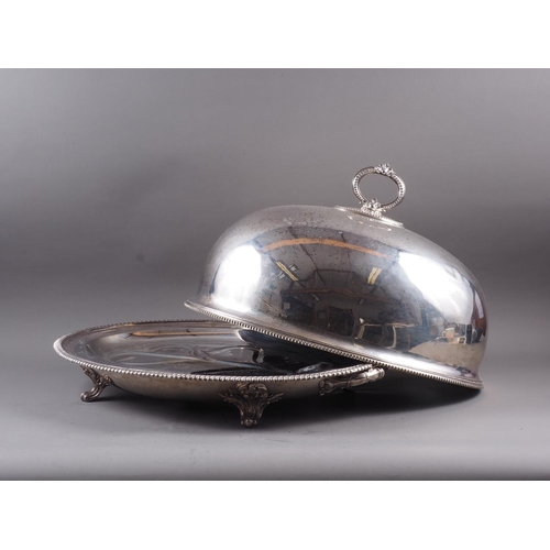 220 - A silver plated two-handled tree and well meat dish and associated dome, on scroll feet, dish 24