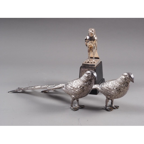 225 - A silver plated presentation falcon, on ebonised stand, 