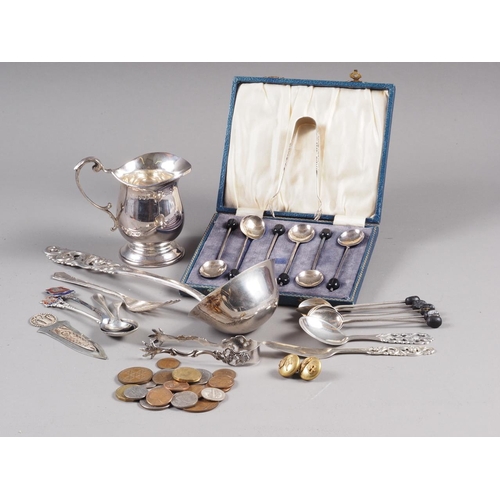 234 - A Norwegian silver openwork handle ladle, a similar butter knife and preserve spoon, a silver cream ... 