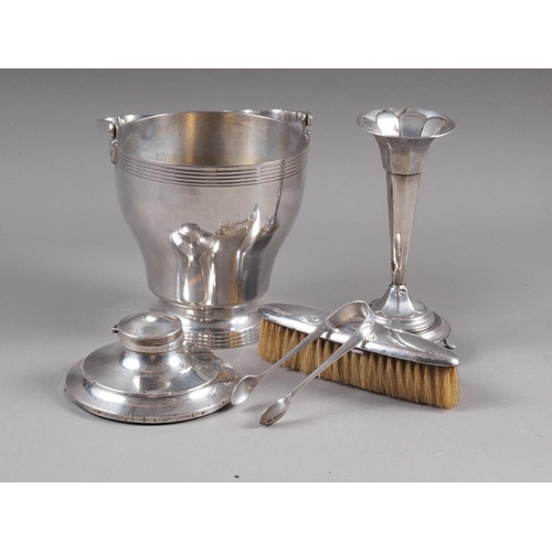 240 - A silver plated ice bucket, a pair of silver sugar tongs, a silver flared rim vase, an inkwell and a... 