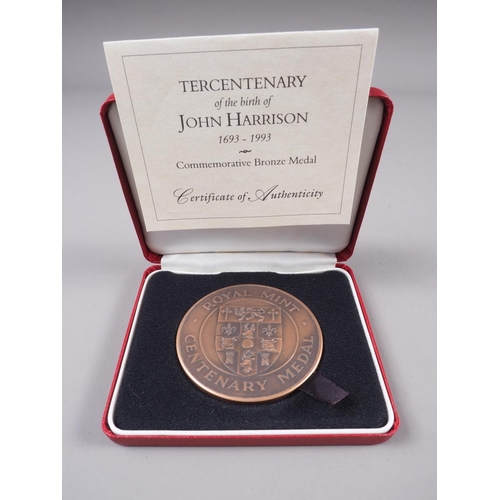 264 - A Royal Mint silver medallion, commemorating the Tercentenary of the birth of John Harrison, and two... 